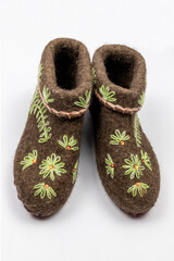 Valenki with embroidery. Traditional russian winter felt boots for women on white background.