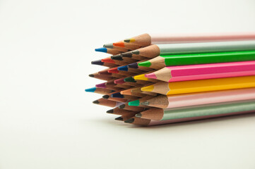 colored pencils on a white background. education concept. illustration of training.