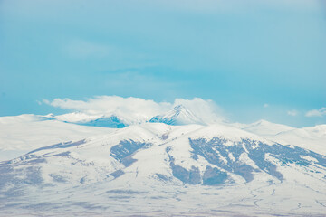 Fototapeta na wymiar winter mountain landscape and blue sky