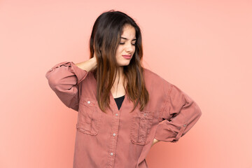 Fototapeta premium Young caucasian woman isolated on pink background with neckache