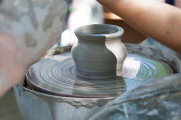 Potter shaping a ceramic pot