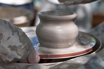 Potter shaping a ceramic pot