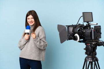 Young reporter woman holding a microphone and reporting news points finger at you