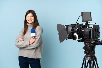 Young reporter woman holding a microphone and reporting news laughing