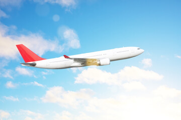 Naklejka na ściany i meble Plane travel, international flight, plane flying in the blue sky above the clouds.