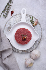 Raw uncooked spicy beefsteaks cutlet