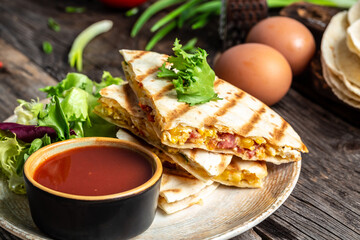 Closeup of a cheese and egg quesadilla. Mexican cuisine, Mexico and Latin America traditional restaurant menu dishes, food cooking recipe