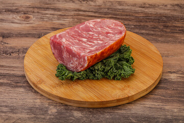 Beef ham piece over board