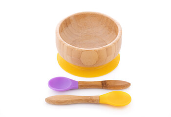 Wooden bowl. Bamboo plate with spoon isolated on white background