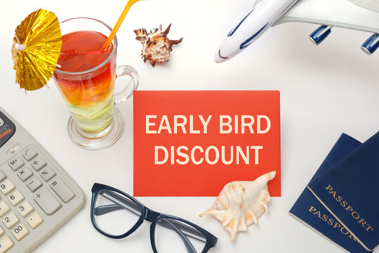 Early bird discount - the inscription on the notebook, cocktails, plane, documents.