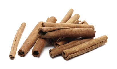 Cinnamon sticks pile isolated on white background