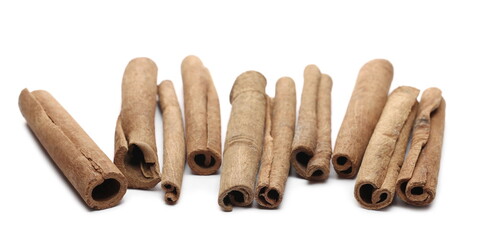 Cinnamon sticks pile isolated on white background