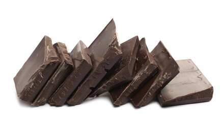 Chocolate bar pieces pile isolated on white background