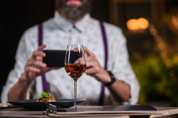 young man in restaurant with wine