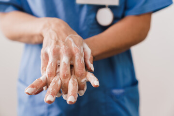 Close up of a female doctor washing her hands