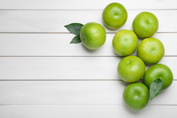 Fresh ripe sweeties on white wooden table, flat lay. Space for text