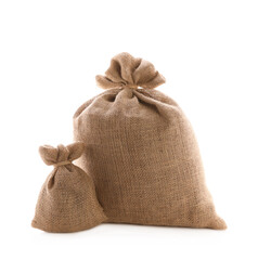 Tied burlap bags on white background. Organic material