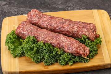 Raw minced beef kebab skewer