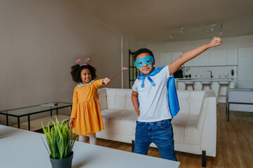 Children having fun playing together wearing costume