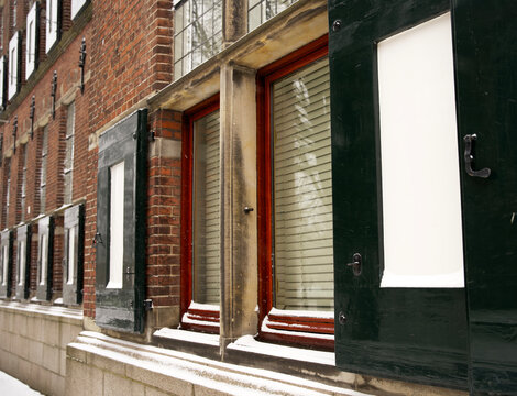 Windows with shutters on an historical building at the martini kerkhof in groningen
