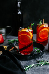 Hot mulled wine in a transparent glass on the table