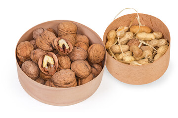 Dried walnuts and peanuts in two wooden round boxes