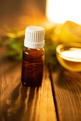 Dripping essential oil into a bottle