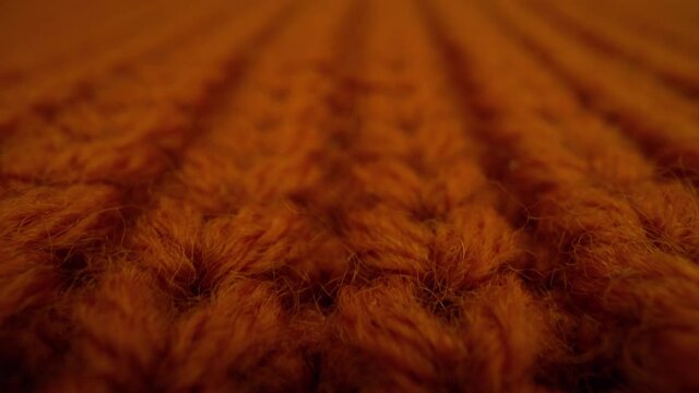 Close-up red fabric knitted texture background.