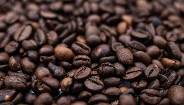 Background image with roasted brown coffee beans