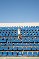 Teenage doing sports alone at the empty stadium
