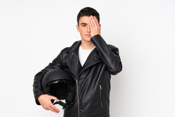 Man holding a motorcycle helmet isolated on white background covering a eye by hand