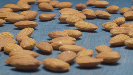 Almond nuts on blue