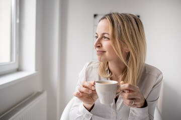 Business woman enjoy coffee break while working in 5office