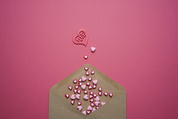Valentines Day Wishes. Pink And Red Heart Shape Beads On Pink Background