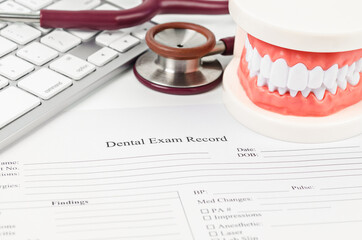 Dental exam record and model teeth with stethoscope medical.