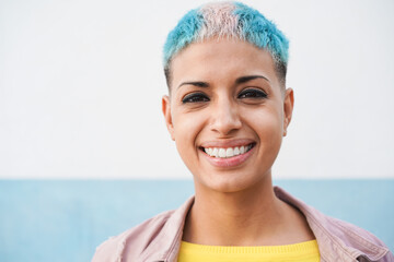 Portrait of hispanic gay woman looking at camera - Focus on face - obrazy, fototapety, plakaty