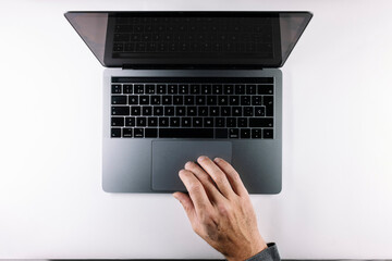 Fototapeta na wymiar Hands typing on gray laptop