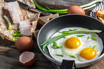 Two fried eggs and bacon lard breakfast. Traditional Ukrainian or belorussian food. banner, menu recipe place for text, top view