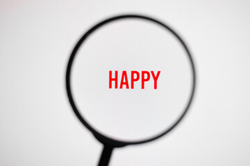 Word happy on white screen through magnifying glass