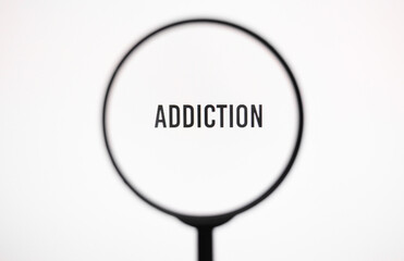 Text addiction on white screen through magnifying glass