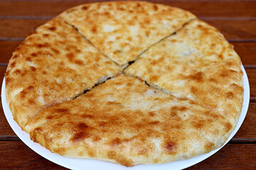 Plate of Kubdari, the North-western Georgian Traditional Flat Bread Stuffed with Spiced Pork or Beef