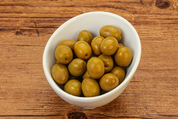 Green pickled olives in the bowl