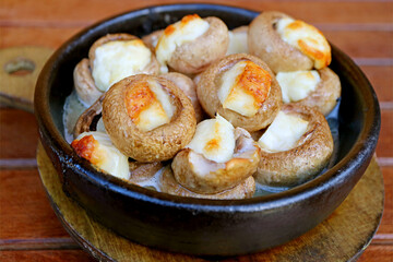 Closeup of Mouthwatering Soko Ketze or Georgian Stuffed Mushrooms with Sulguni Cheese