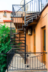Outdoor spiral stairs, fire escape on a building