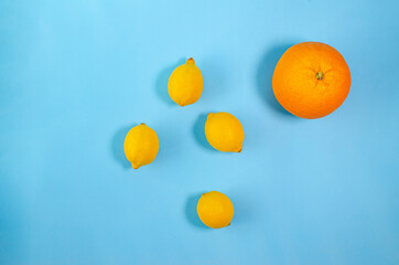 juicy ripe citrus fruits on a blue background as a symbol of health and well-being