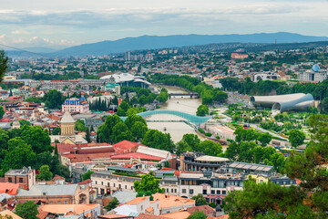 Fototapeta na wymiar Tbilisi, Georgia. Panoramic beautiful picture of Cityscape Of Summer Old Town.