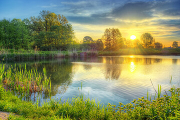 Amazing colorful sunrise on the lake in Poland