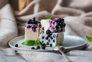 Slices of delicious no baked cheesecake with fresh blueberry and mint