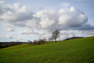 Fototapeta na wymiar Clouds and landscape on a February afternoon in Bavaria