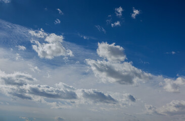 Good weather white fluffy clouds in the blue sky